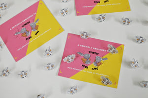 Squeeze Your Cans Pin and Postcard Set
